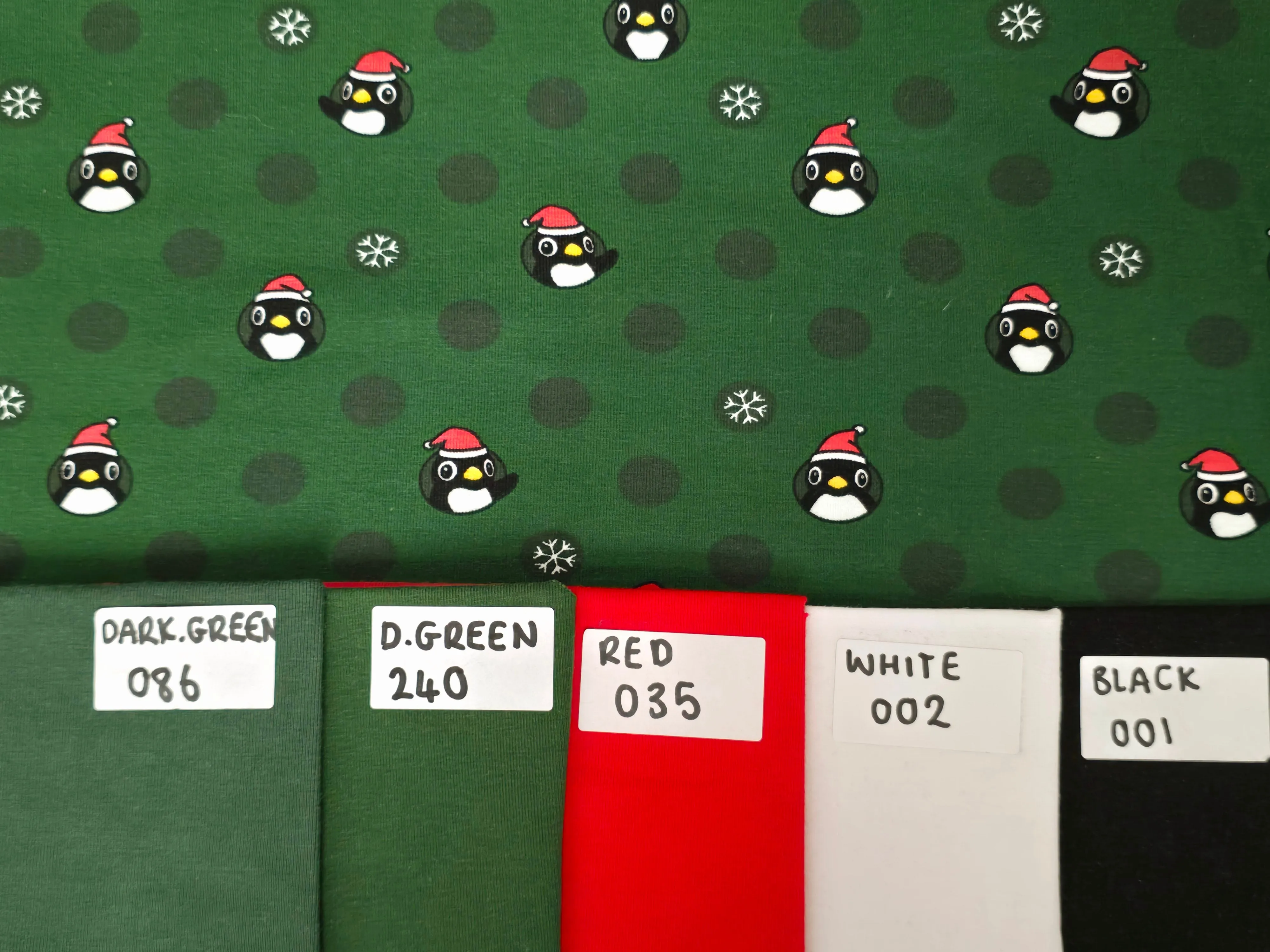 GREEN CHRISTMAS PENGUINS COTTON JERSEY PER METRE SALE